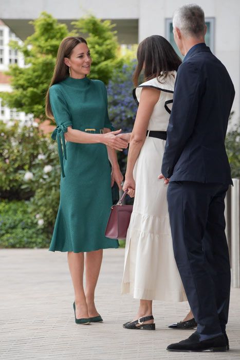 kate shaking hands