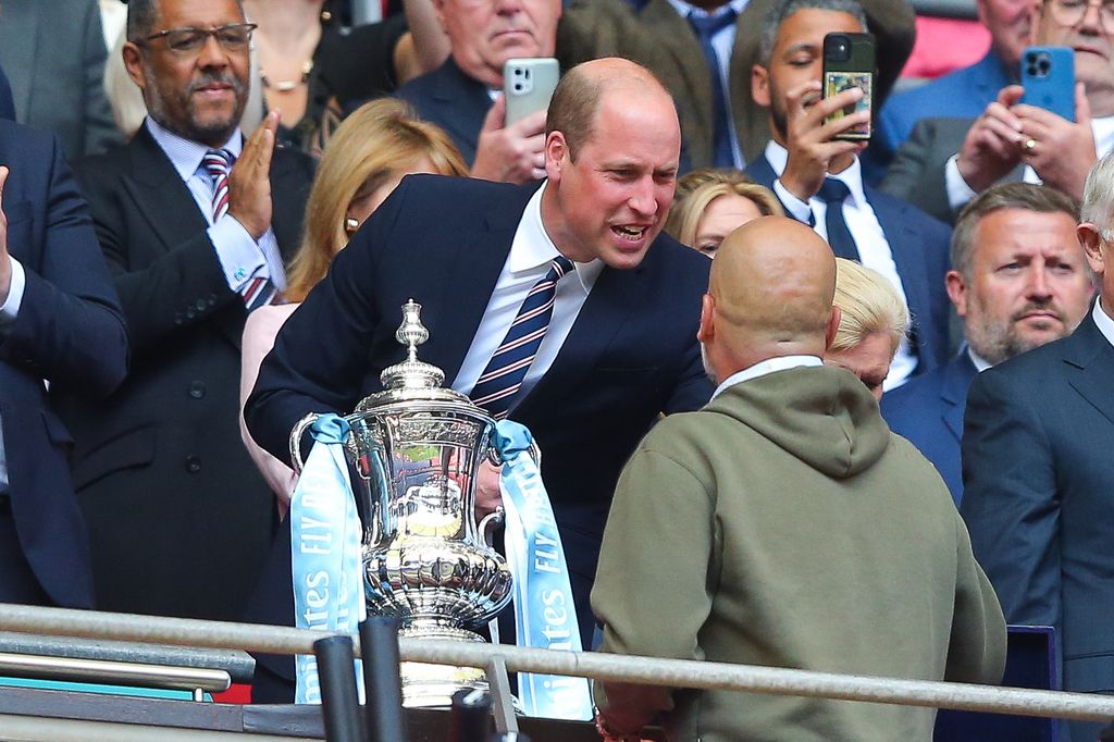 Josep 'Pep' Guardiola, manager of Manchester City, is greeted by William, Prince of Wales,after the FA Cup final match