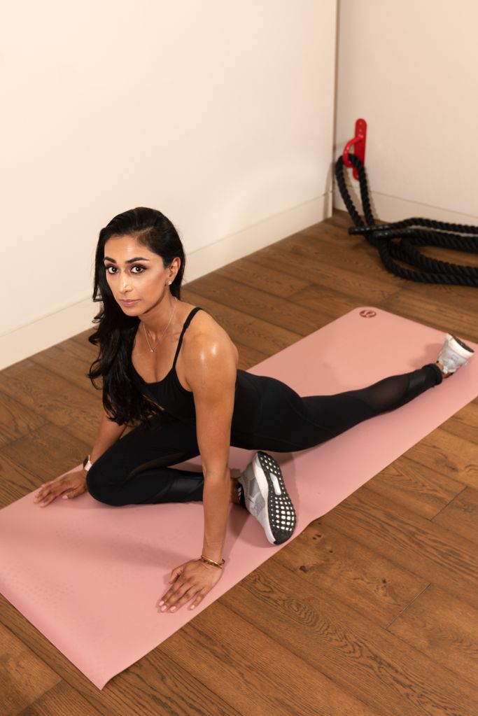 Lavina Mehta working out on pink yoga mat 