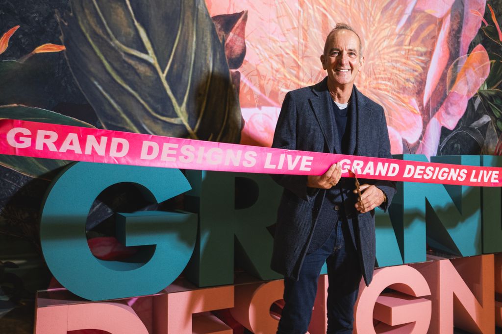 Kevin McCloud cutting a ribbon for Grand Designs Live