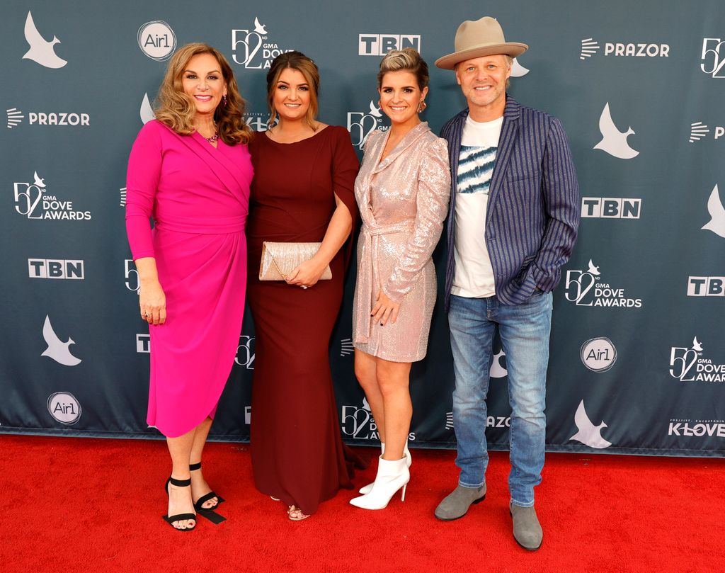 Kelly Nelon Clark, Amber Nelon Thompson, Autumn Nelon Clark, and Jason Clark of The Nelons attend the 52nd GMA Dove Awards at Lipscomb Allen Arena on October 19, 2021 in Nashville, Tennessee