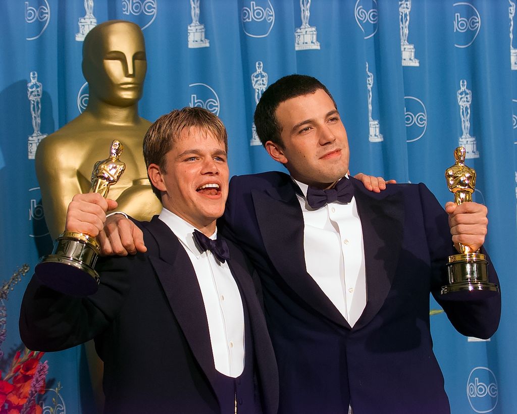 Ben Affleck and Matt Damon hold their Oscar Awards backstage at Academy Awards Show, March 23, 1998 in Los Angeles, California