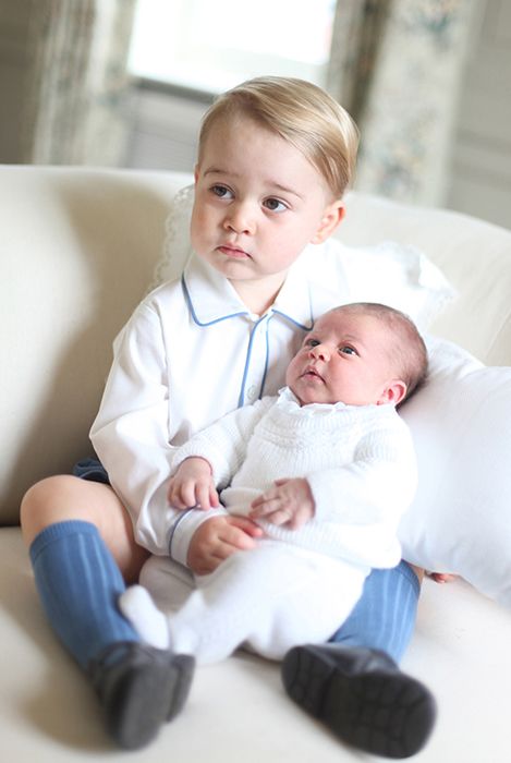 prince george holding princess charlotte baby