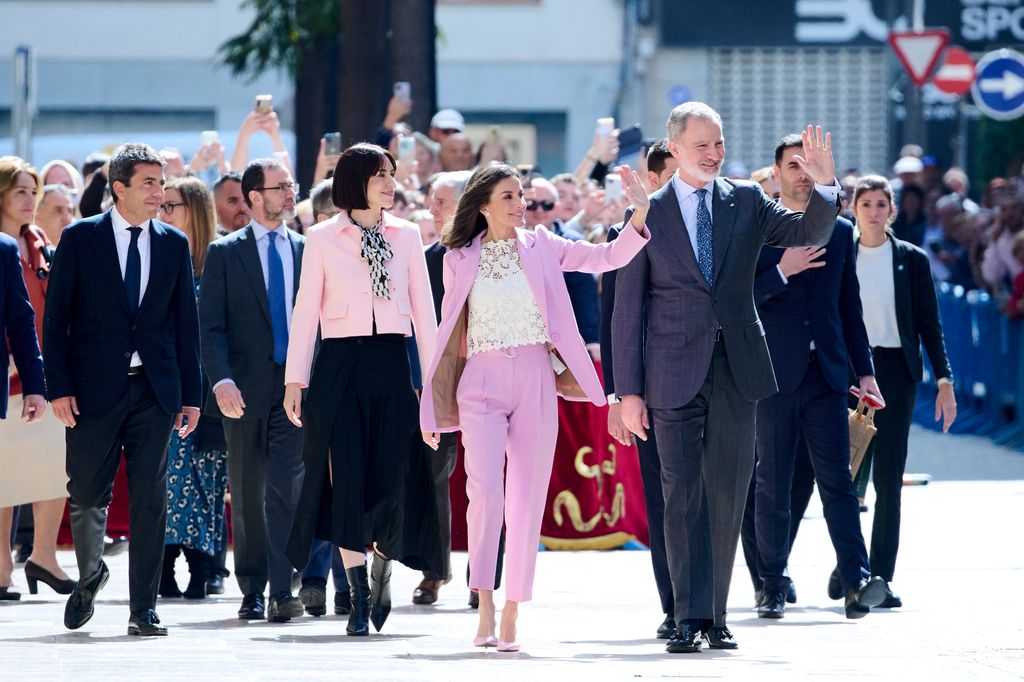 Diana Morant walking with waving King Felipe and Queen Letizia