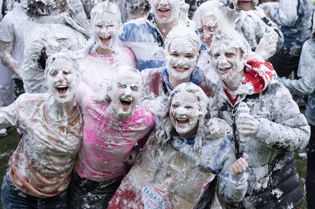 Students covered in shaving foam for Raisin Monday at St Andrews