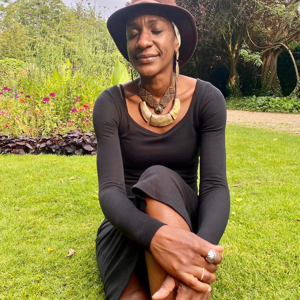 woman in a long-sleeved black top in nature 