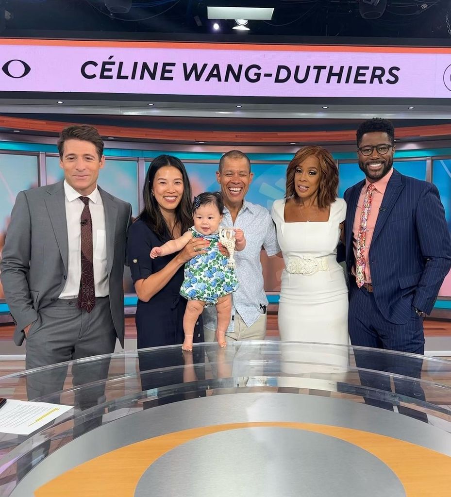 Tony Dokoupil, Marian Wang, Vladimir Duthiers, Gayle King and Nate Burleson pose on the CBS Mornings set with Vlad's newborn daughter Celine