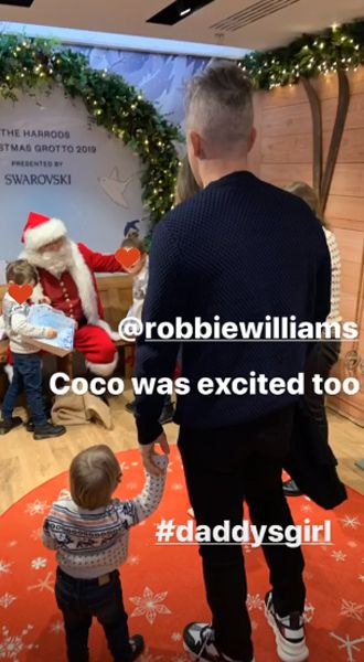 robbie williams son meets santa