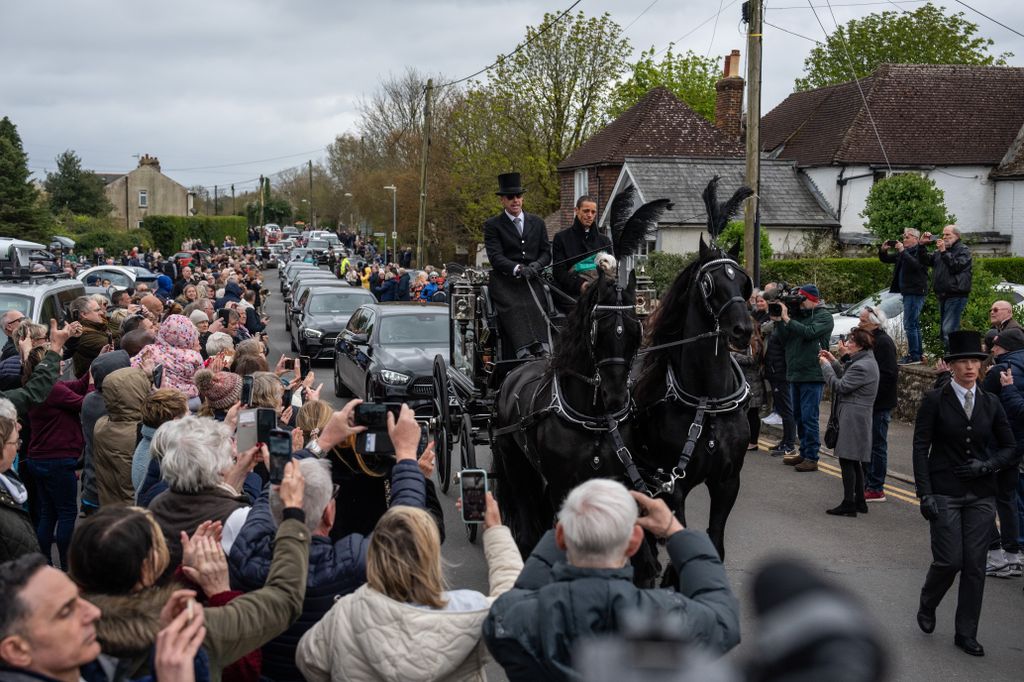 Paul's husband Andre leading the funeral procession