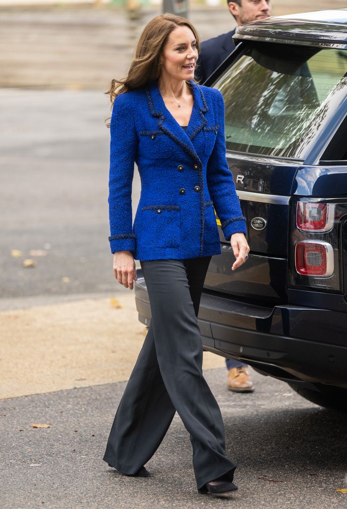 The Princess of Wales beside car in cobalt blazer and black trousers