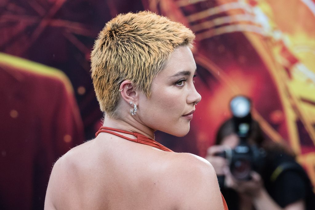 The star debuted a fiery red buzzcut at the event