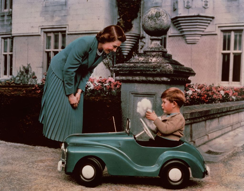 Prince Charles playing with his toy car
