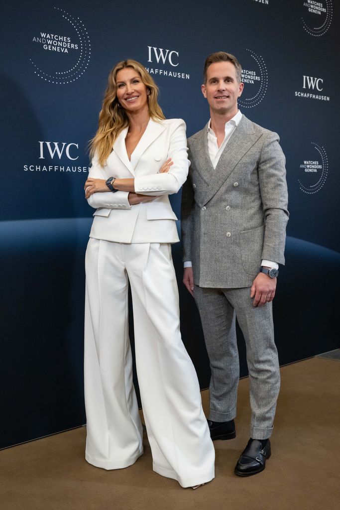 Gisele in white suit with WC Schaffhausen CEO Chris Grainger-Herr 