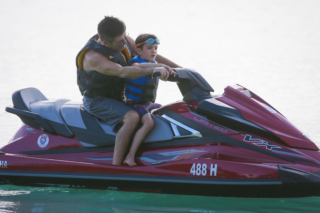 Simon Cowell and son Eric exploring the ocean
