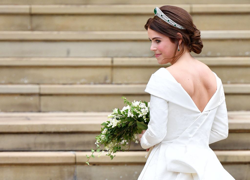 Princess Eugenie looking over her shoulder on the steps of St George's Chapel
