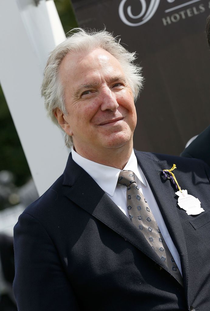 alan rickman suit smiling