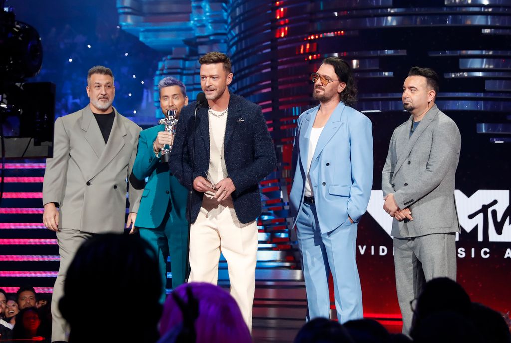 Joey Fatone, Lance Bass, Justin Timberlake, JC Chasez, and Chris Kirkpatrick of  *NSYNC speak onstage the 2023 MTV Video Music Awards at Prudential Center on September 12, 2023