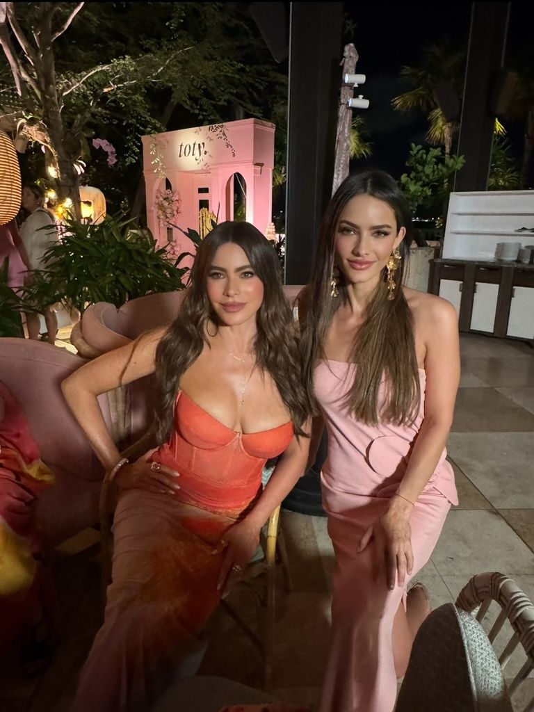 photo of sofia vergara and sister sandra vergara in strapless dresses