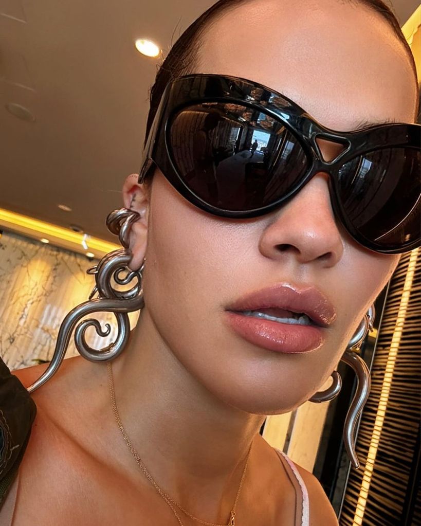 Rita Ora wearing Panesconi earrings and Saint Laurent sunnies
