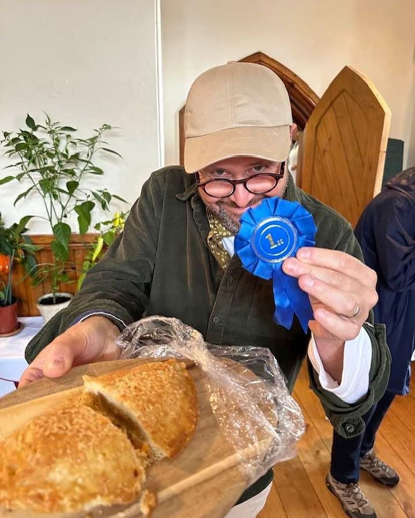 Jon Kay with his first-place rosette after winning a pasty bake off