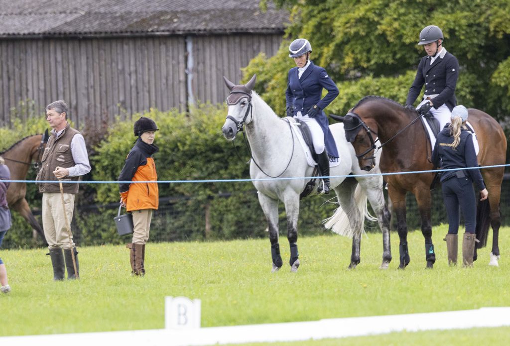 Princess Anne stood next to Zara Tindall on a horse