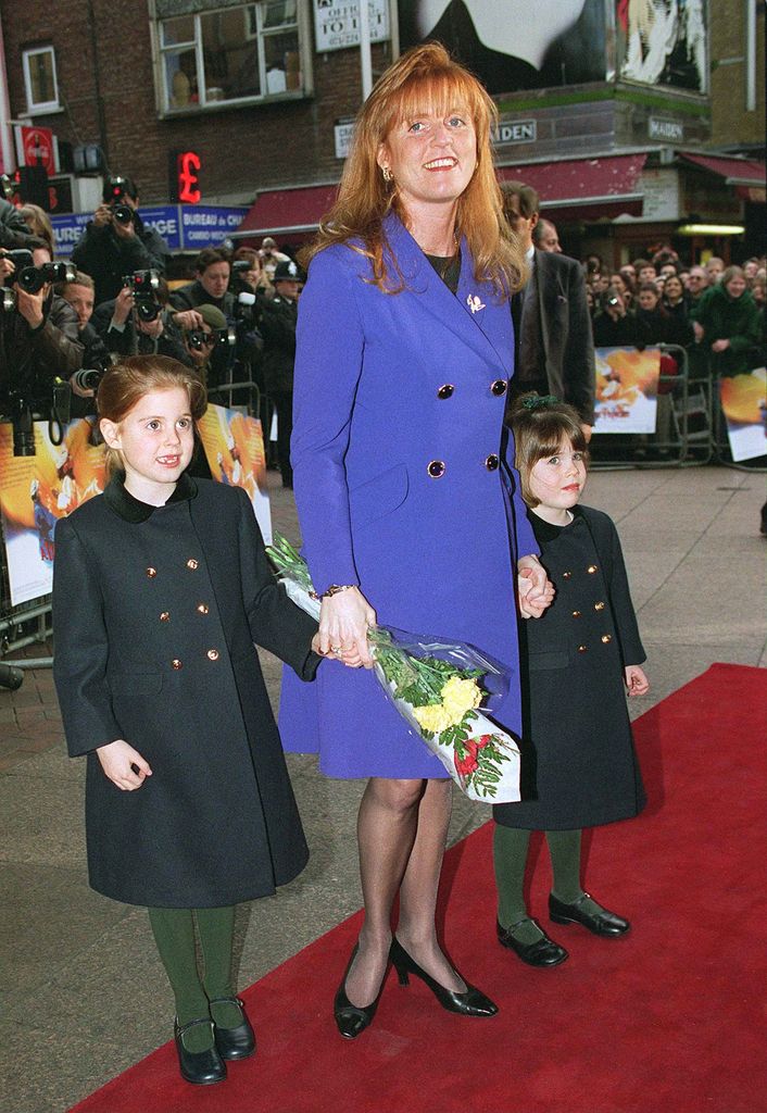 sarah ferguson on red carpet with beatrice and eugenie as children