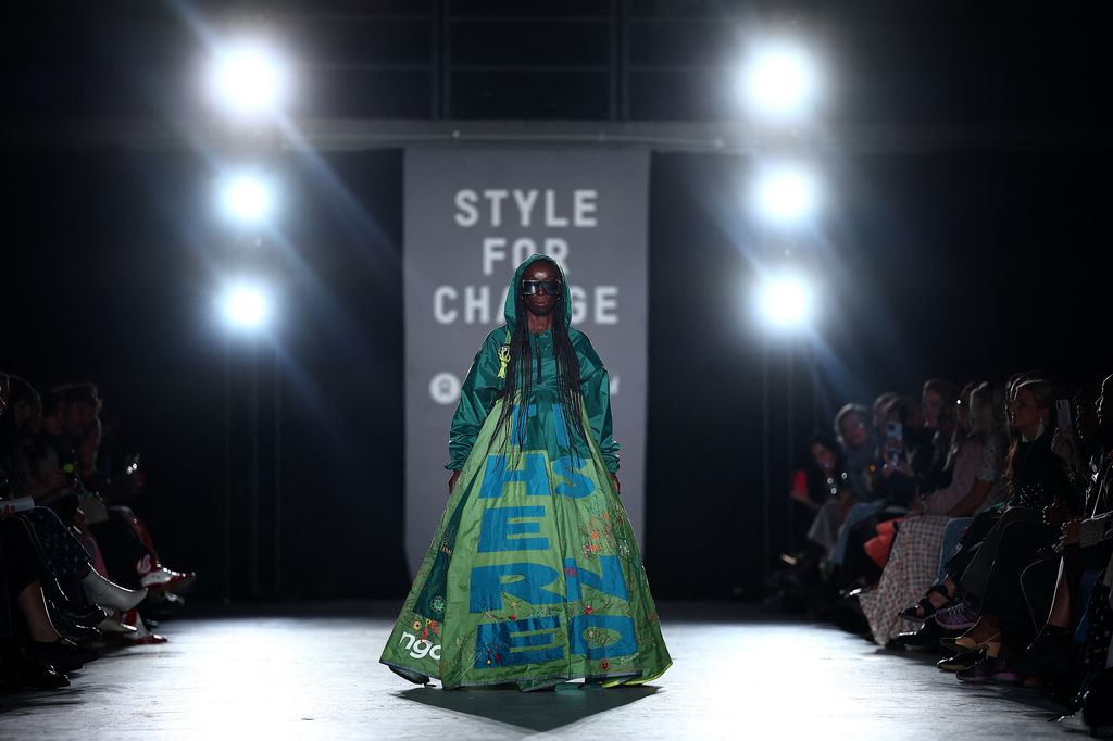 A model presents a creation, made from an old festival tent, during a catwalk presentation for the Oxfam Style for Change Spring/Summer 2025 collection, at London Fashion Week