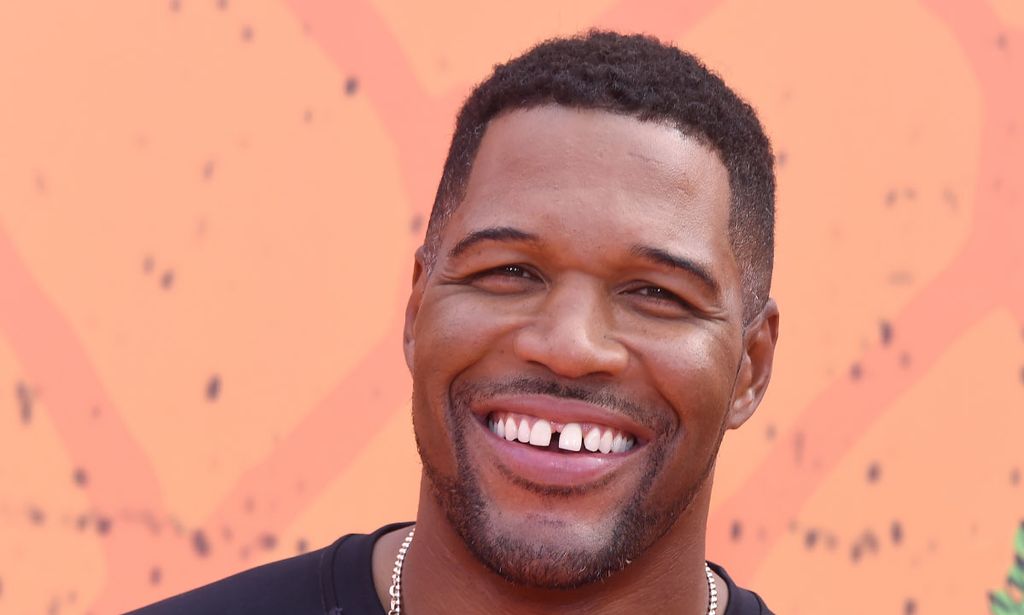 Michael Strahan smiles broadly in photo on red carpet