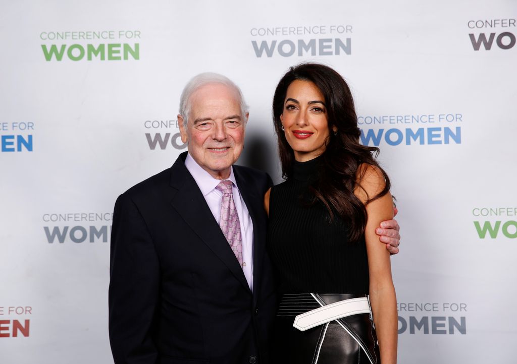 Broadcaster Nick Clooney and Human rights lawyer Amal Clooney pose for a photo together backstage during 2018 Massachusetts Conference For Women at Boston Convention & Exhibition Center on December 6, 2018 in Boston, Massachusetts.
