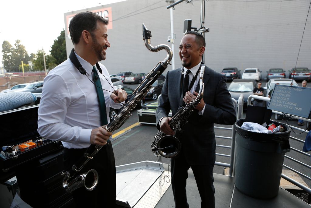 Jimmy and Cleto smiling while playing in a band