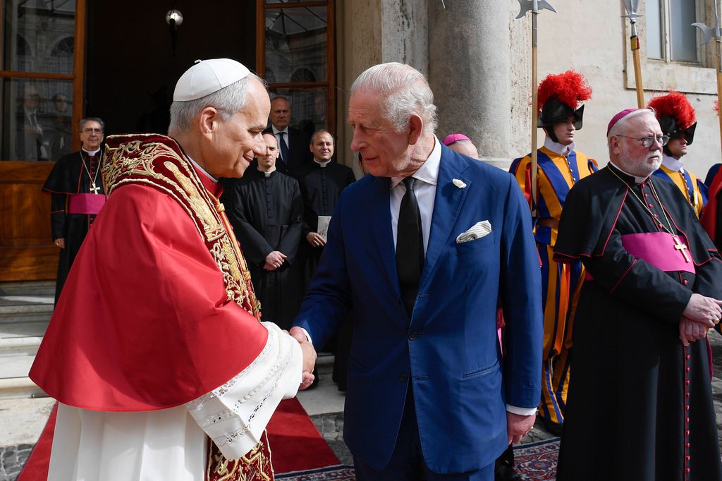 Pope Leo XVI shales hands with King Charles III as they leave the Apostolic Palace on October 23, 2025 in Vatican City, Vatican.