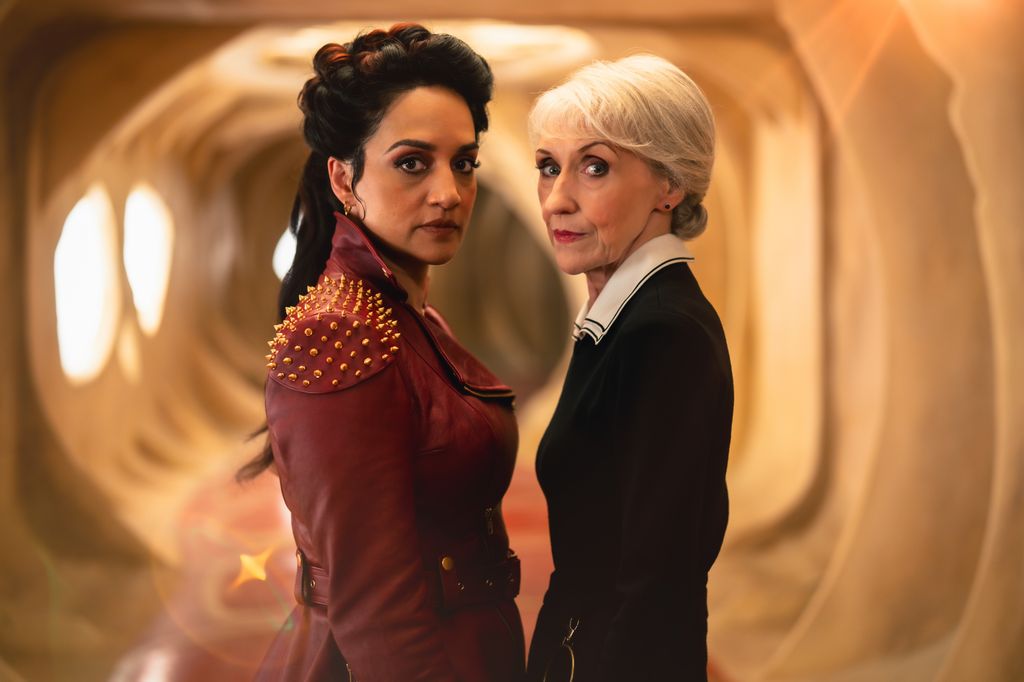 Archie Panjabi standing opposite Anita Dobson