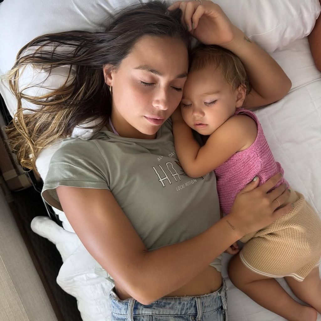 Tia Blanco and her daughter taking a nap