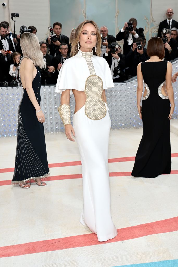 Olivia Wilde at the Met Gala 2023 wearing a white and gold gown