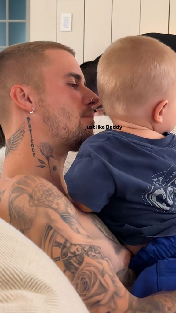 Justin Bieber topless holding his son Jack