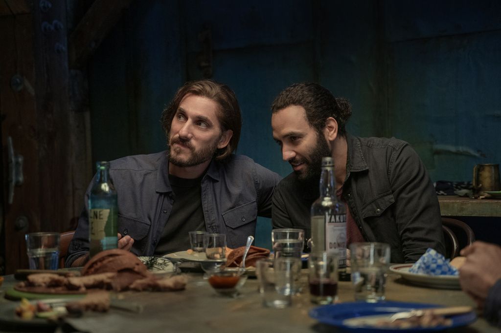 two men sitting at table 