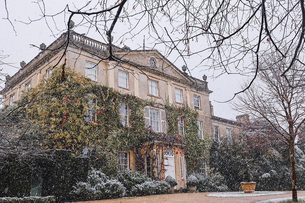 A country house surrounded by snow