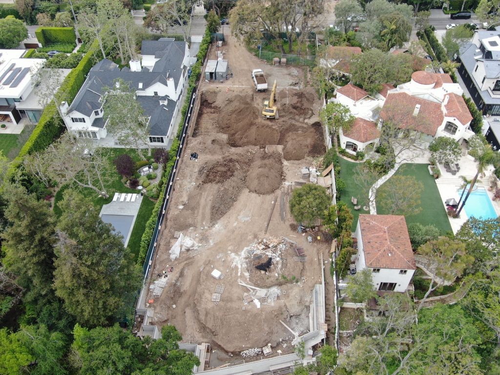 Chris Pratt and his wife Katherine Schwarzenegger Pratt have completely demolished a famed mid-20th Century Los Angeles home known as the Zimmerman House which they bought for $12.5million in January 2023. This photo shows the demolition, as the previous mid-century classic one story has vanished with trucks clearing up the debris.