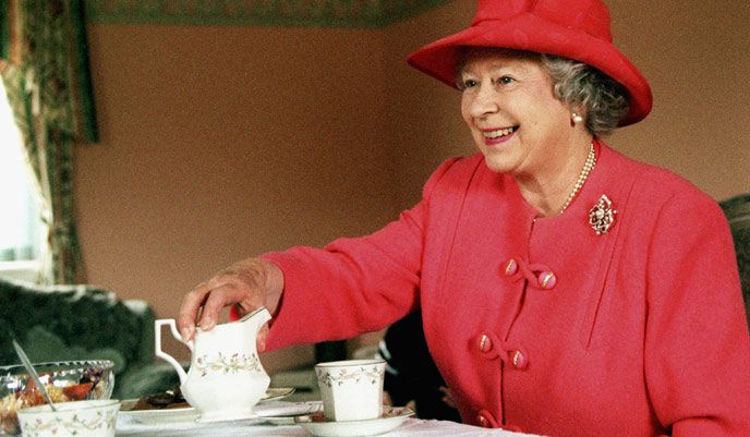 Queen Elizabeth II drinks tea