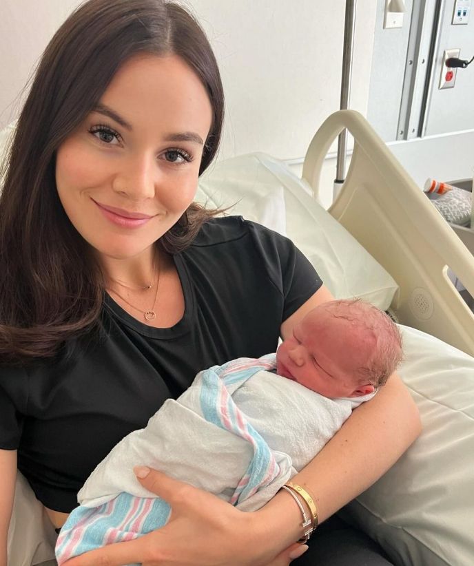 Holly Ramsay holding a baby