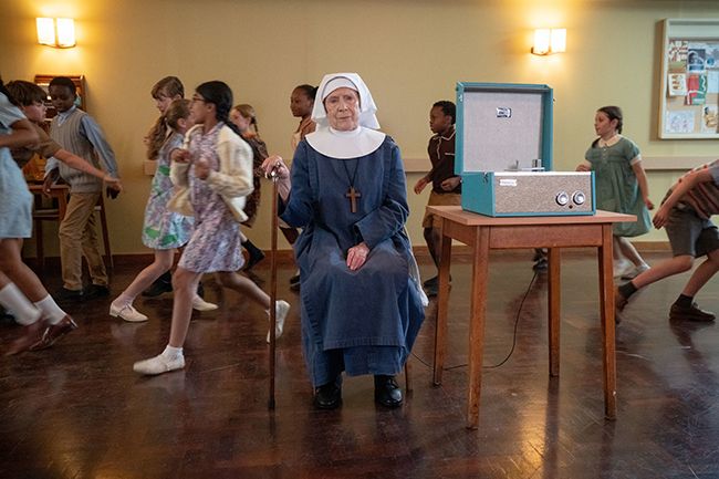 Sister Joan sit in church hall in Call the Midwife