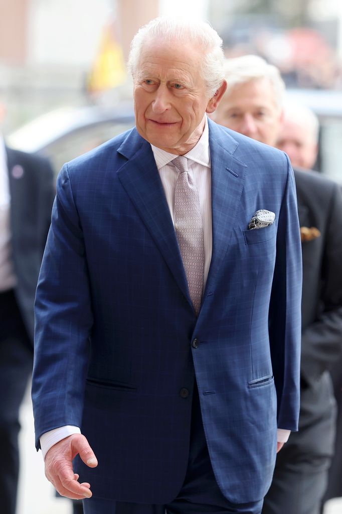 King Charles in blue suit at Westminster Abbey