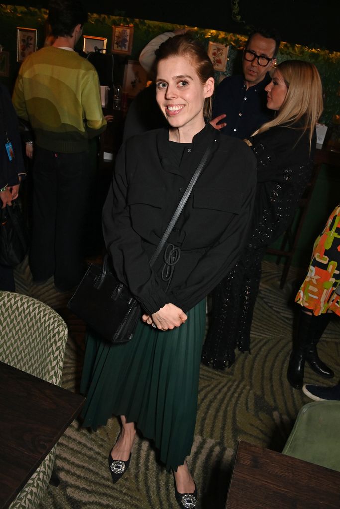 Princess Beatrice smiling in black outfit