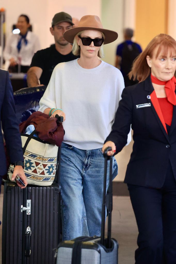 Charlize lands in Sydney ahead of filming for a new Netflix thriller called Apex