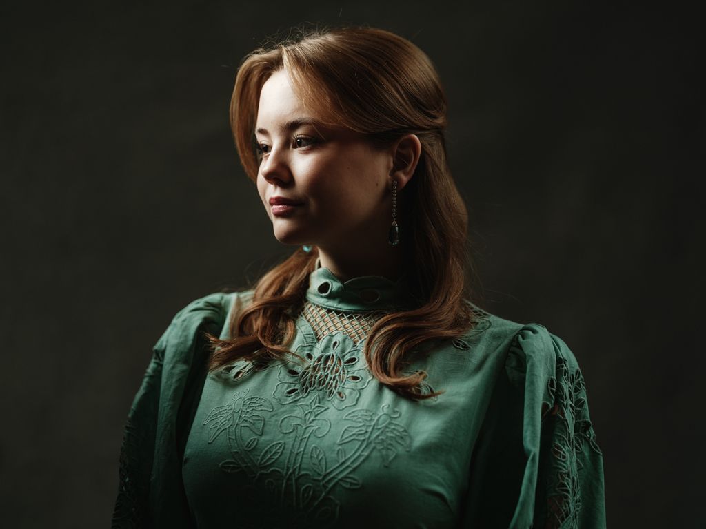 Princess Ariane wearing green dress in 18th birthday portrait