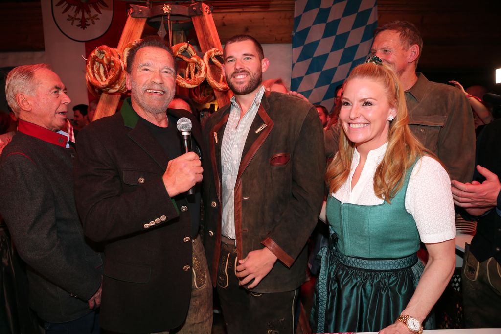 Arnold Schwarzenegger his son Christopher Schwarzenegger and Heather Milligan during the 31st WeiÃwurstparty at Hotel Stanglwirt on January 19, 2024 in Going near Kitzbuehel, Austria.