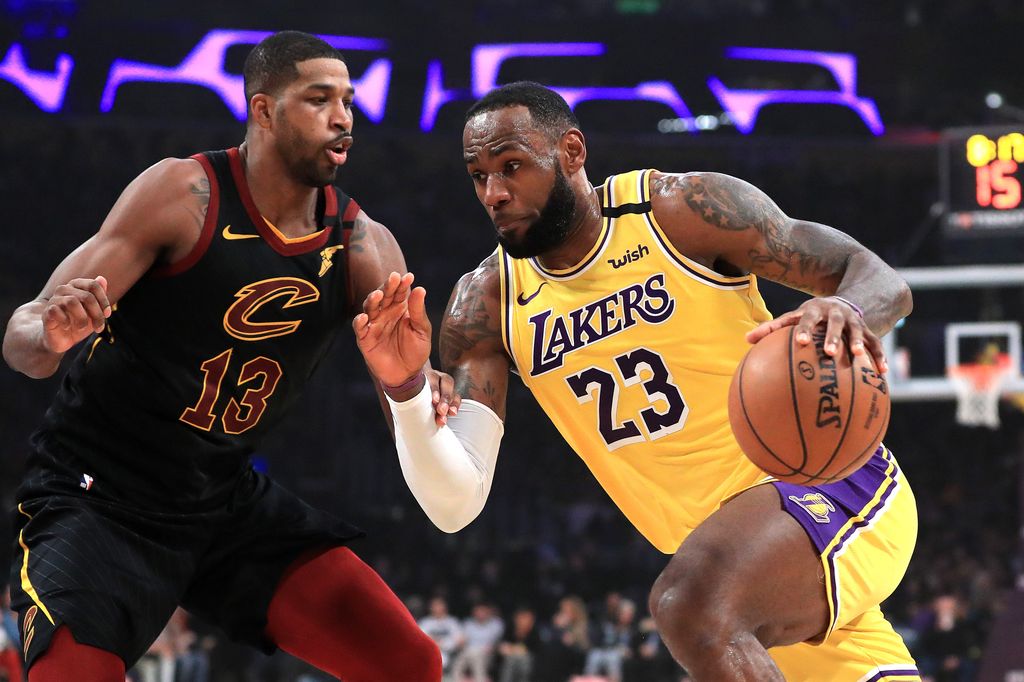 LeBron James #23 of the Los Angeles Lakers dribbles past the defense of Tristan Thompson #13 of the Cleveland Cavaliers during the first half of a game at Staples Center on January 13, 2020