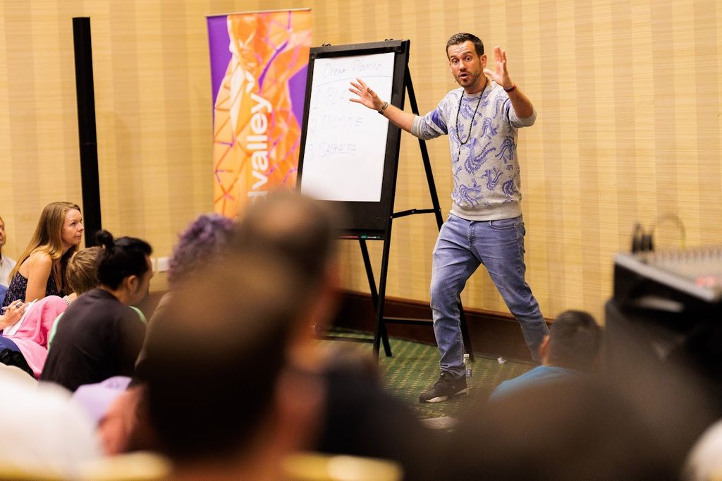 Charlie giving a talk at Mindvalley