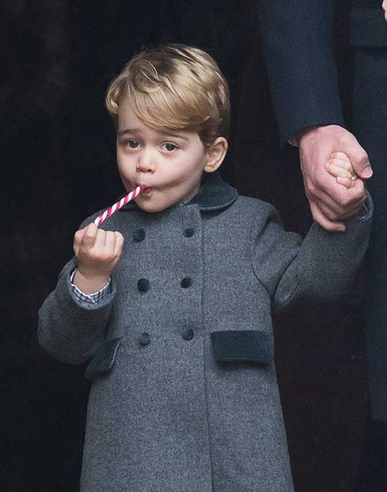 Prince George eating a festive candy cane