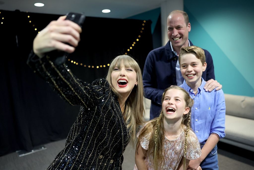 taylor swift, princess charlotte, prince george and prince william posing for a selfie